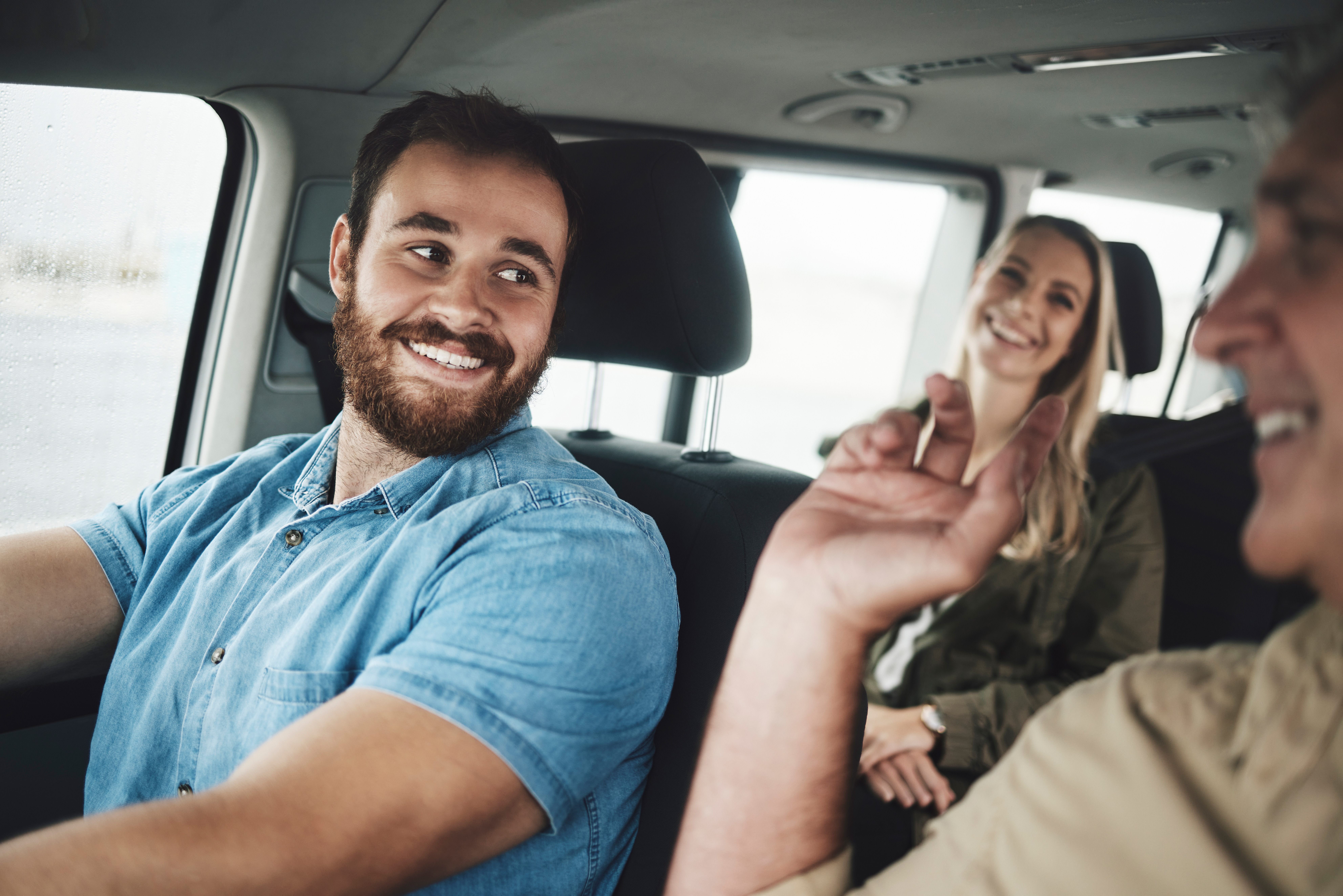 happy-man-driving-car-travel-on-road-trip-for-fam-2023-11-27-05-35-52-utc