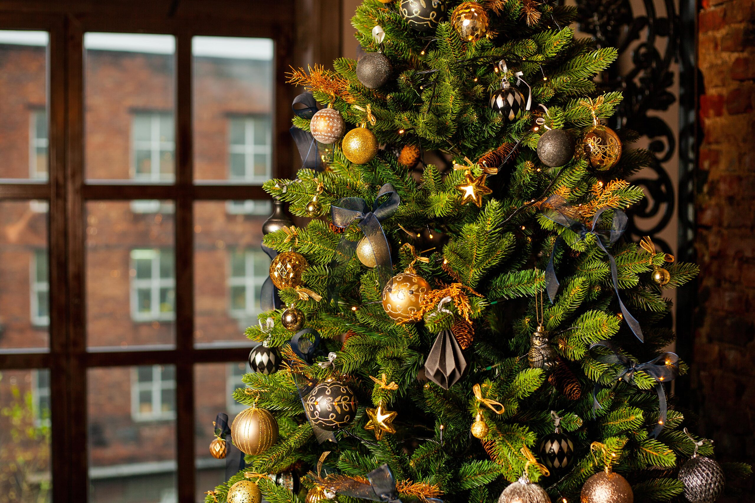close-up-of-a-christmas-tree-decorated-with-gold-b-2023-11-27-04-50-24-utc_0-min