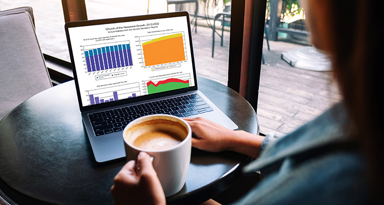Mockup image of a woman using and typing on laptop with blank wh
