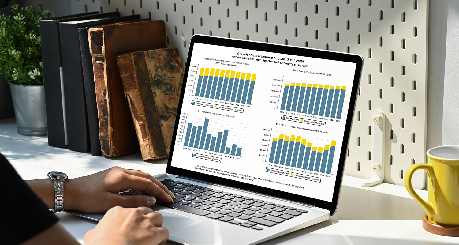 Woman hands using laptop computer with blank screen on white tab